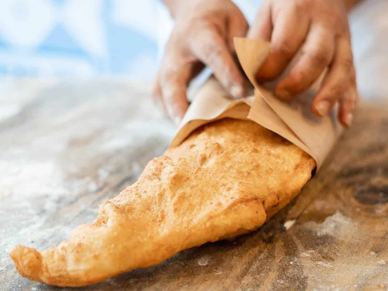 Whole golden Neapolitan pizza fritta served fresh at Pizza Fritta 180, showcasing authentic Italian street food in Sydney