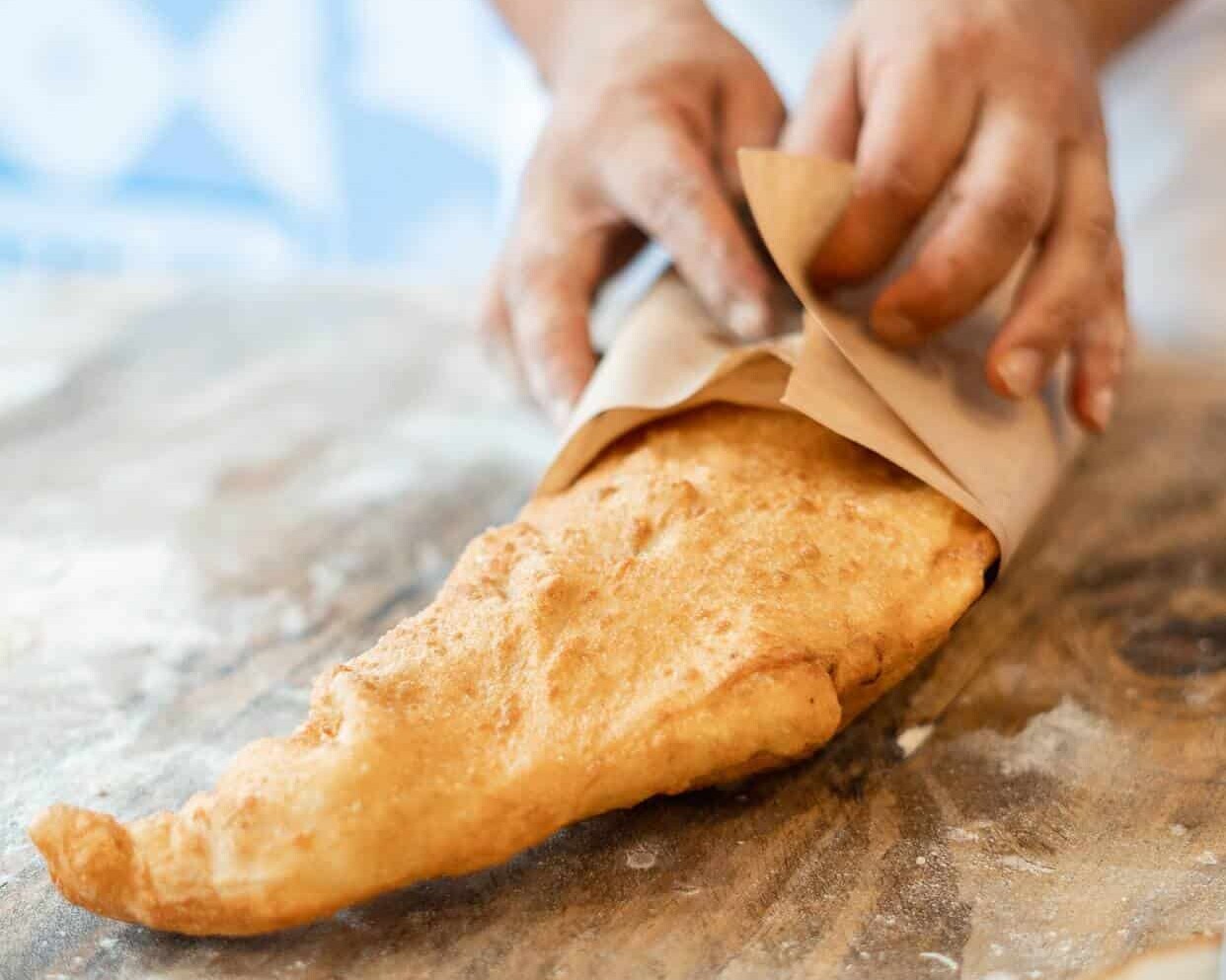 Whole golden Neapolitan pizza fritta served fresh at Pizza Fritta 180, showcasing authentic Italian street food in Sydney