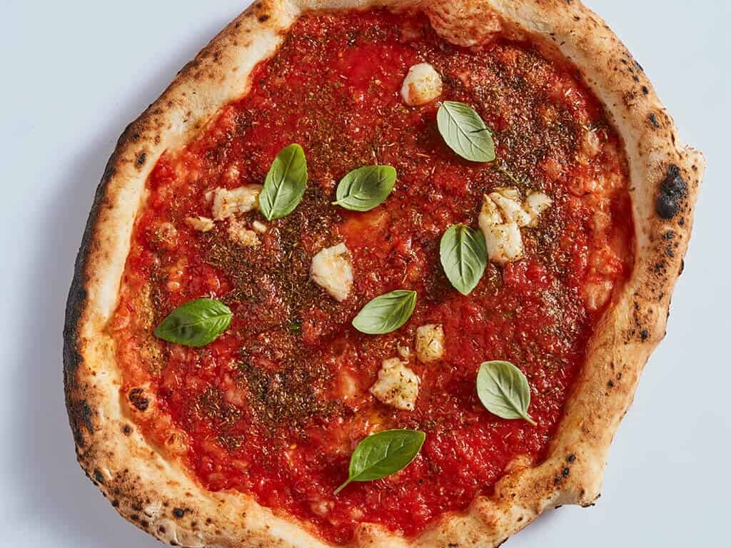 Authentic Neapolitan Marinara pizza fritta with tomato sauce, garlic, and oregano served at Pizza Fritta 180 in Sydney