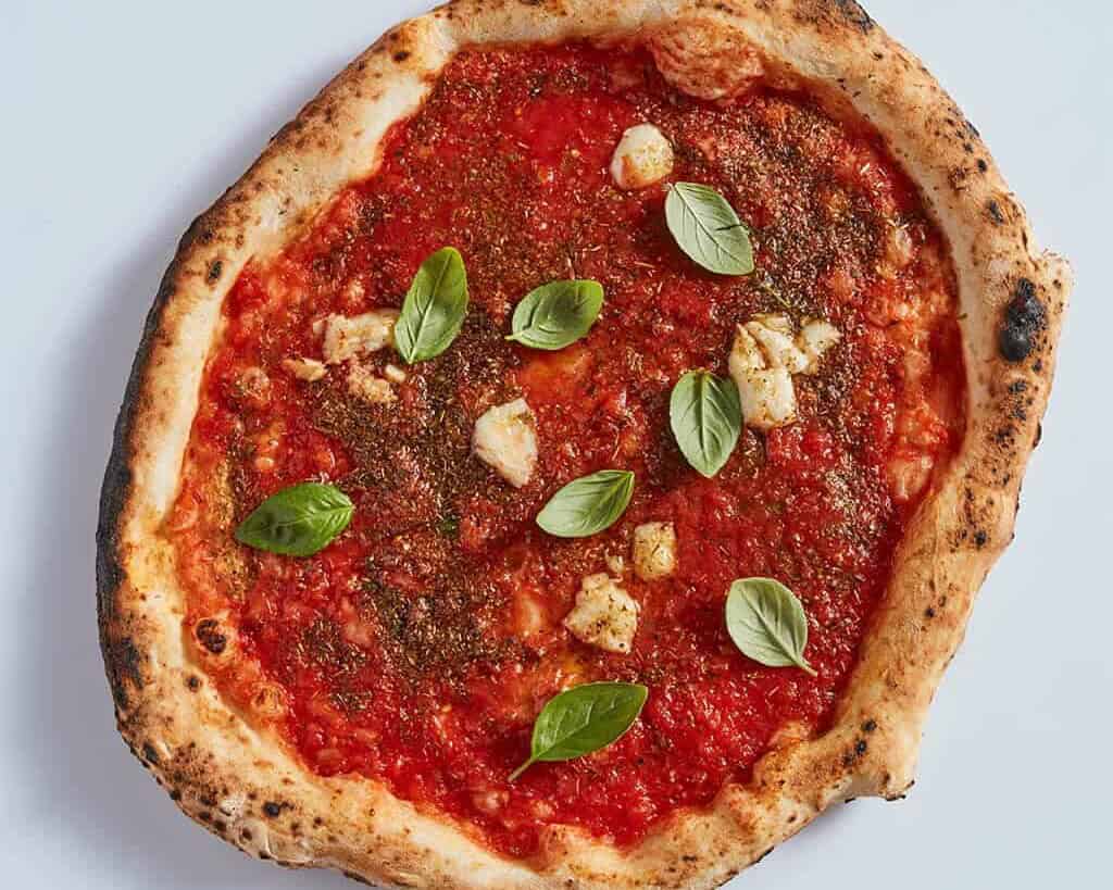 Authentic Neapolitan Marinara pizza fritta with tomato sauce, garlic, and oregano served at Pizza Fritta 180 in Sydney