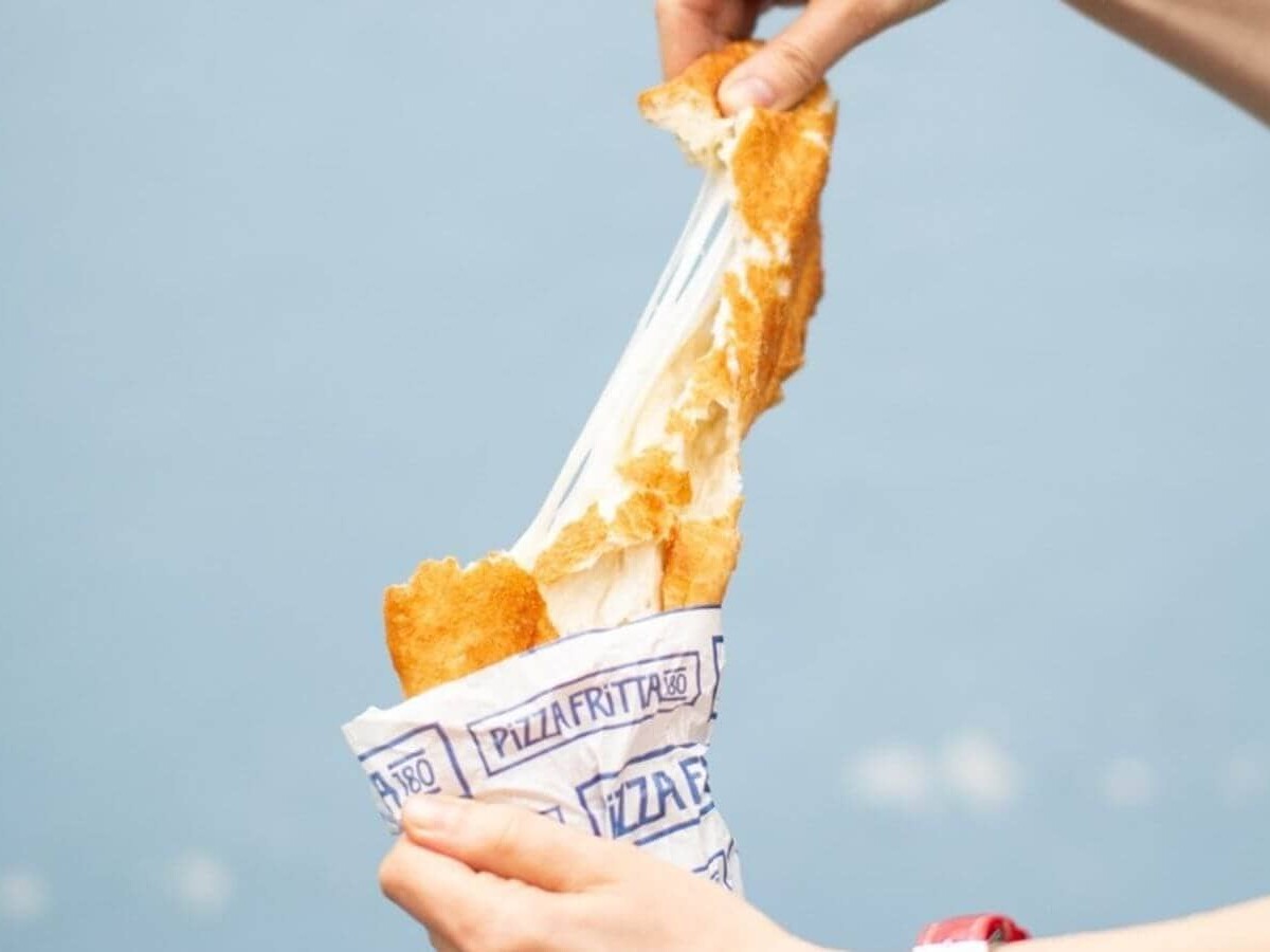 Close-up of golden Neapolitan fried pizza served fresh at Pizza Fritta 180, one of Sydney’s best pizza spots