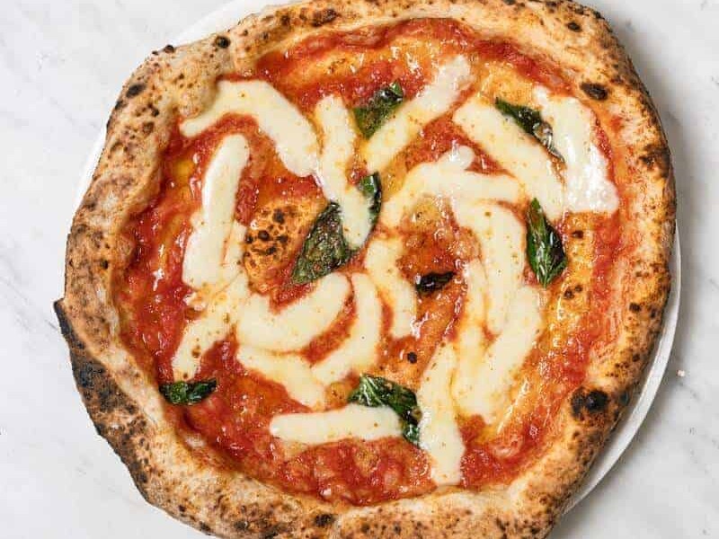 Margherita pizza topped with Solania San Marzano tomatoes, Fior di Latte, Pecorino Romano, Grana Padano DOP, fresh basil, and EVOO at Pizza Fritta 180